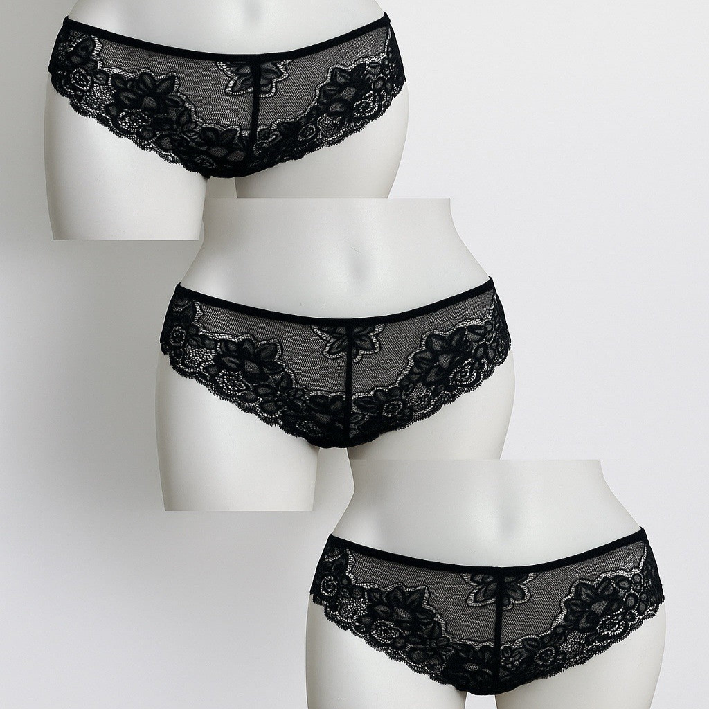 Set of black lace underwear on mannequins against a white background