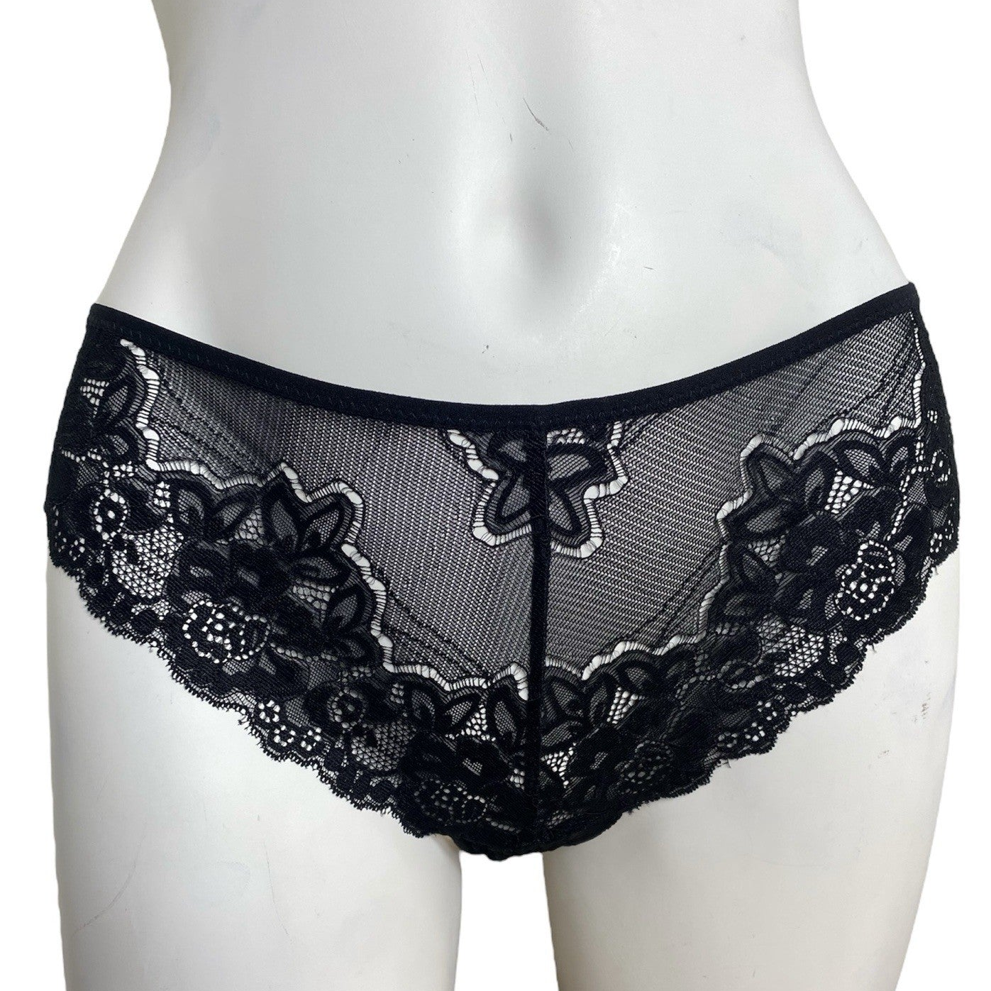 Black lace underwear on a mannequin against a white background