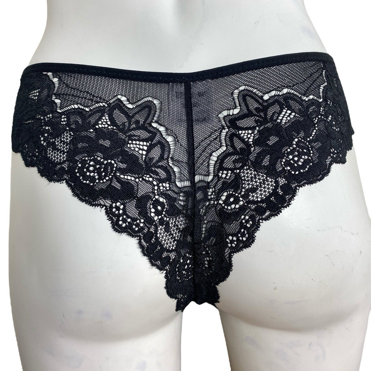 Black lace underwear on a mannequin against a white background