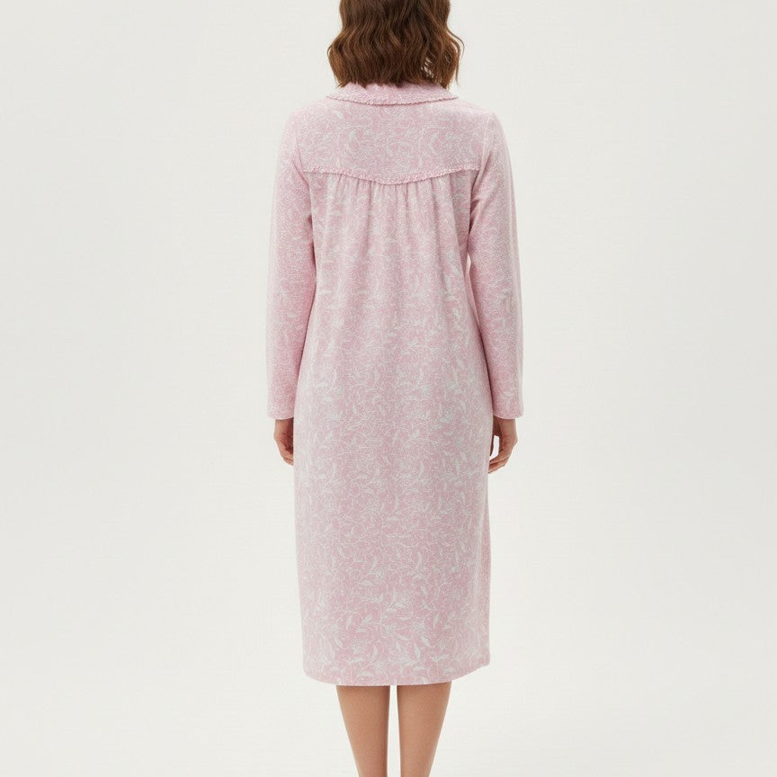 Woman wearing a pink robe on a white background